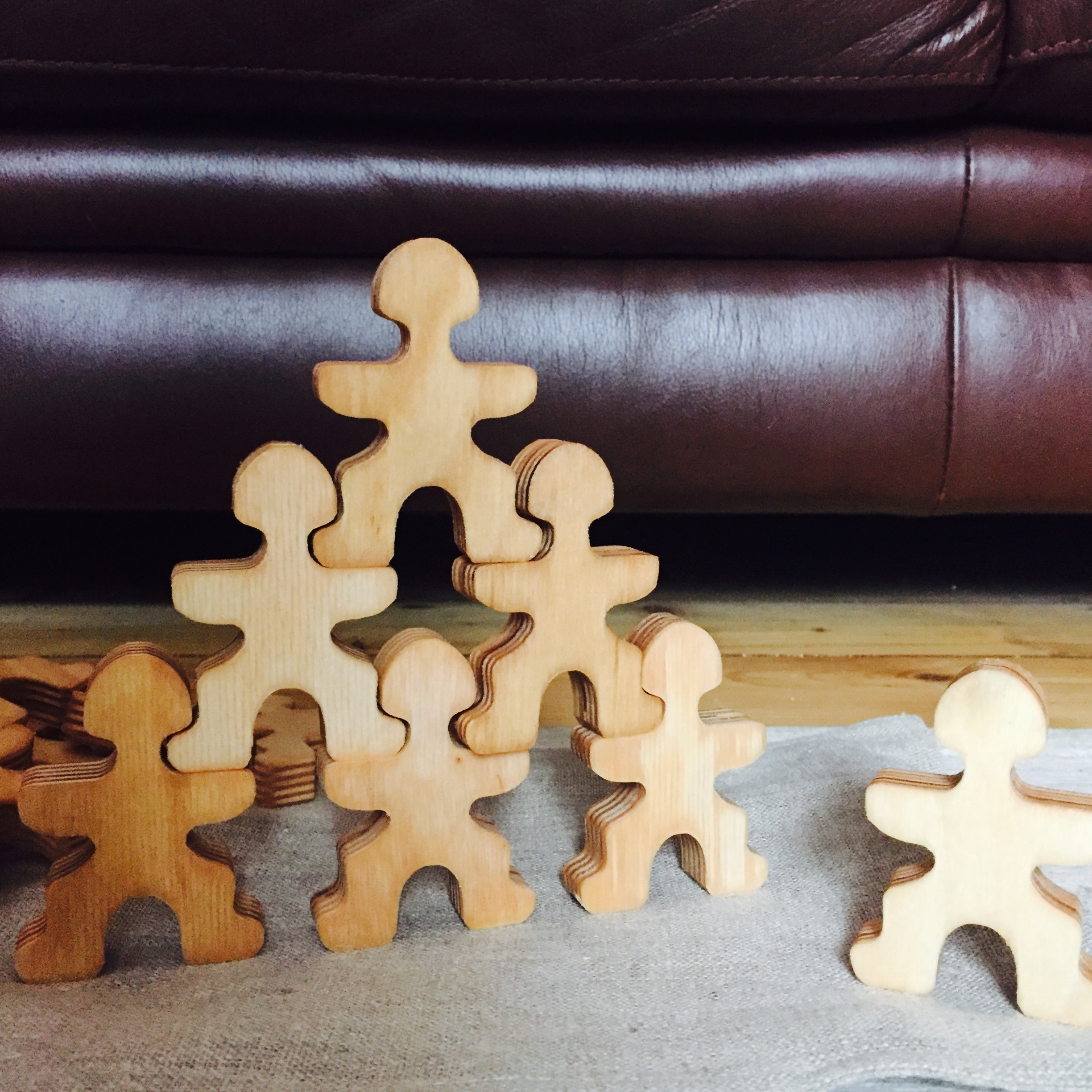 Flockmen wooden toys stacked in play
