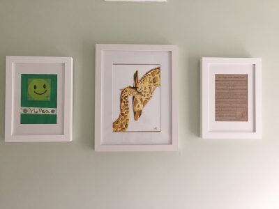 Giraffe painting, Pea image and poem displayed on the wall