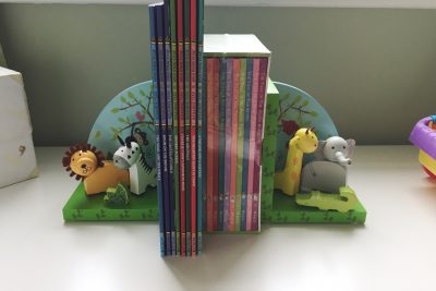 Safari bookends holding up Julia Donaldson and Peter Rabbit books