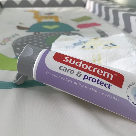 Sudocrem Care & Protect open on changing mat