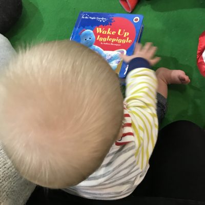 Tall Boy reading In The Night Garden