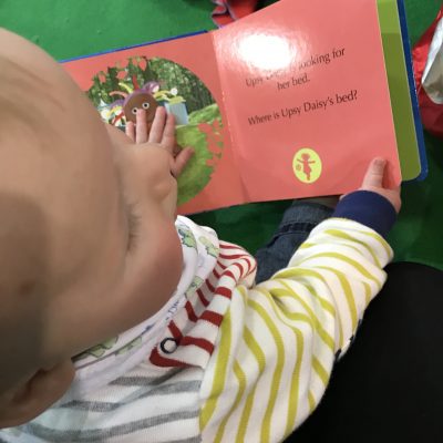 Tall Boy reading In The Night Garden