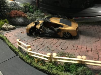 burnt out car on Scalextric track at Stonerig Raceway