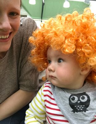 Tall Boy wearing an orange clown wig