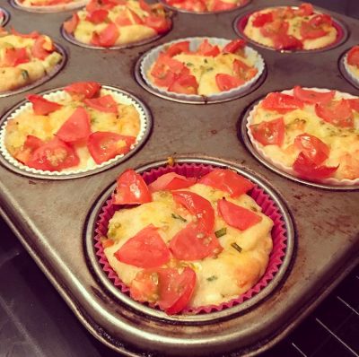 tomato and cheese muffins fresh out of the oven, still in baking tray