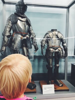 Tall Boy looking at a suit of armour, Salford Art Gallery