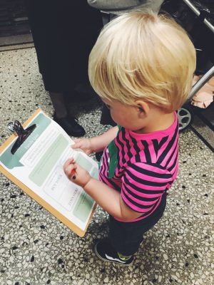 Tall Boy filling in a quiz at Salford Museum