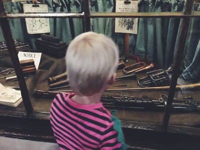 Tall Boy investigating the music shop at Salford Museum