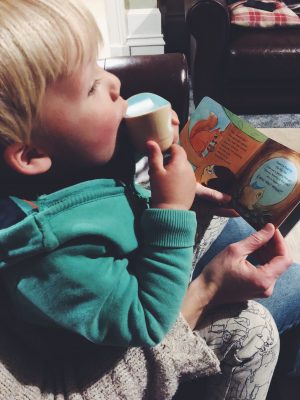 Tall Boy reading Sounds of the Forest and blowing owl whistle