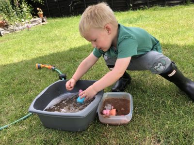 Playing with Peppa Pig in muddy puddles